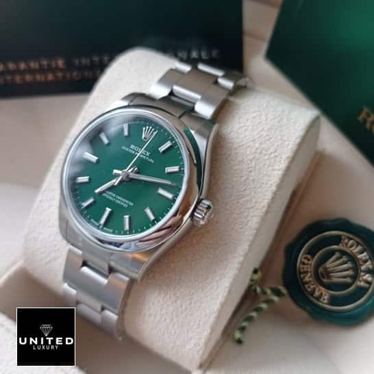 Rolex Oyster Perpetual 277200 Green Dial 2 Rolex Perpetual 31 277200 Stainless Steel Case & clock cushion