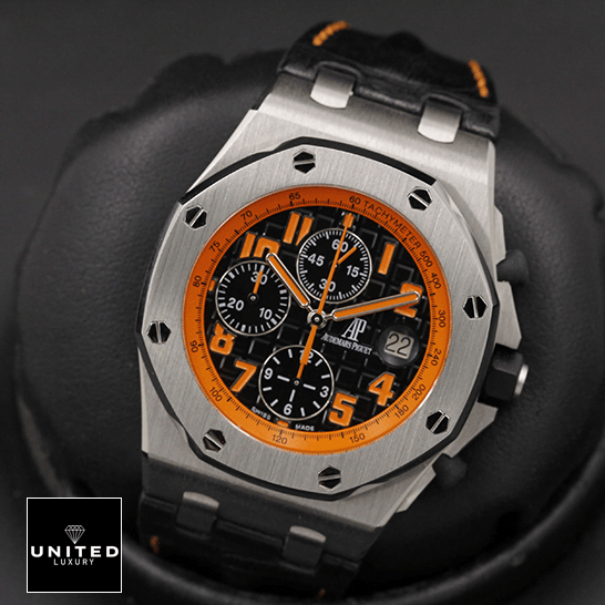 Audemars Piguet Orange Black Dial  in the black stand