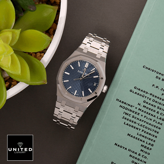 Audemars Piguet Royal Blue Dial Steel Bezel  next to flowers