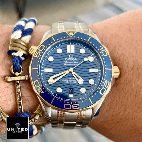 Omega Seamaster Diver 300m Gold Blue Dial  on the man wrist