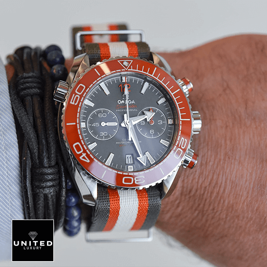 Omega Seamaster Planet Ocean Grey Dial  next to bracelet