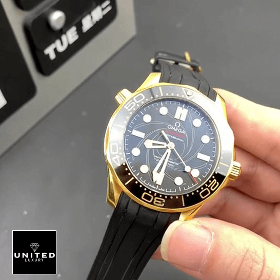 Omega Seamaster Diver 300m Gold Case Black Bezel  on the hand