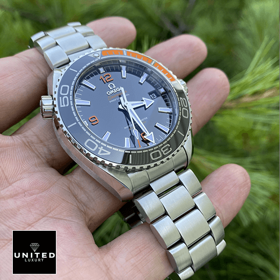 Omega Seamaster Black Dial Oyster Bracelet  on the hand & grass background