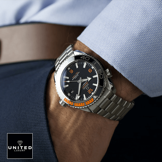 Omega Black Dial Orange Bracelet Oyster  on the man in the suit