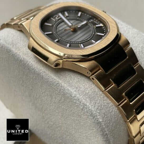 Patek Philippe 7011-1R-010 Black Dial Gold Case  on the stand