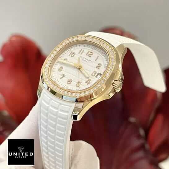 Patek Philippe Aquanaut Luce Diamond Bezel Gold Case  red background