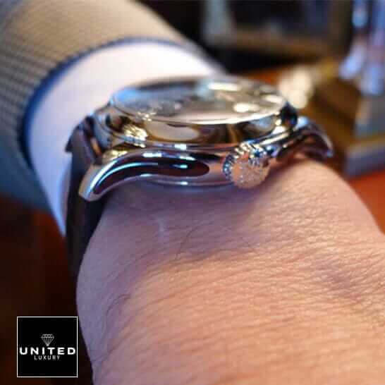 Patek Philippe Geneve Steel Case  on the man wrist and crown on the logo