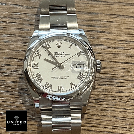 Rolex Datejust 126200-0008 White dial on the table