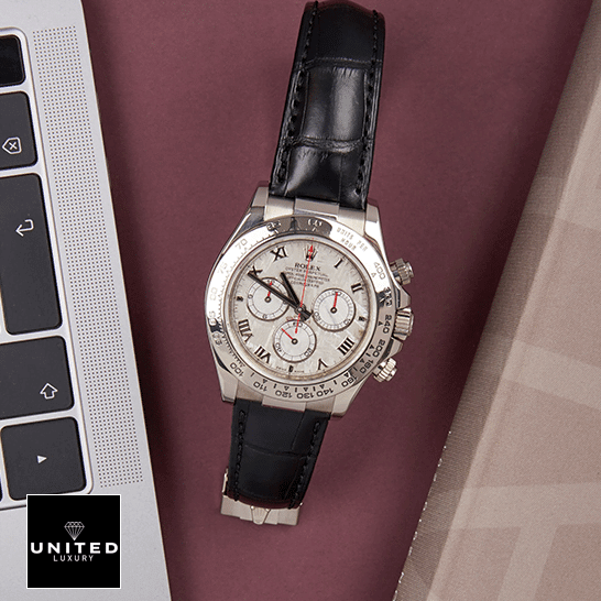 Rolex Daytona 116519 Stainless Steel Case Black Leather  on the table