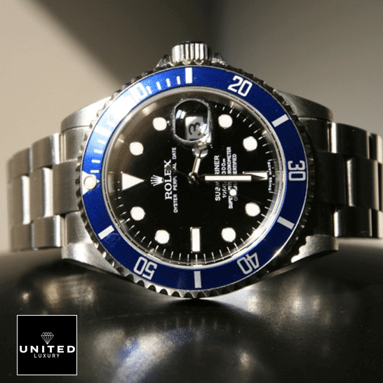 Rolex Submariner Date 16610 Black Dial Oyster  on the table