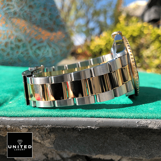 Rolex Submariner 16613 Serti Two Tone Stainless Steel Gold Diamond  on the table