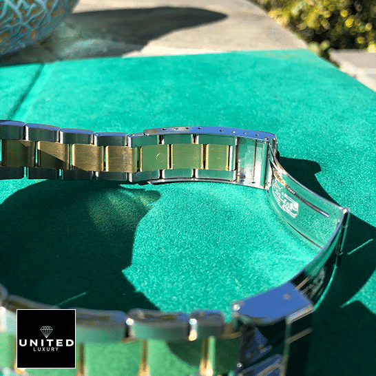 Rolex Submariner 16613 Two Tone Stainless Steel Gold Diamond  on the table