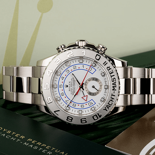 Rolex Yatch Master 116689-0001 White Dial  next to warranty card