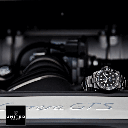 Rolex Blaken GMT-Master II 116710 Black Oyster  on the black table