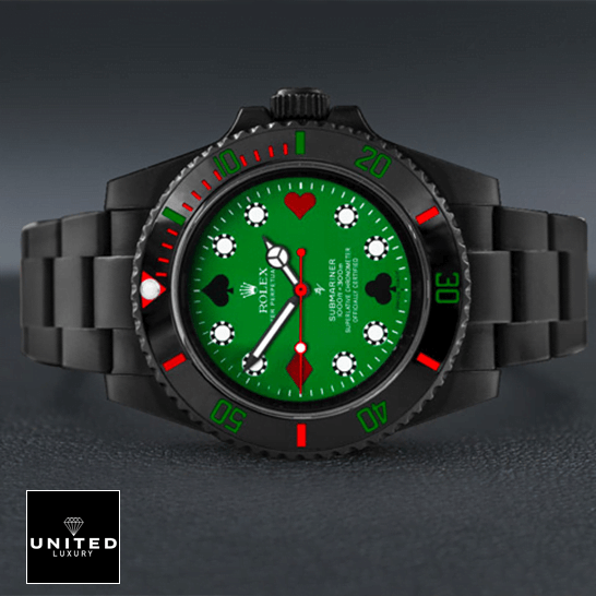 Rolex 114060 Blaken Submariner Poker Green Dial  on the table