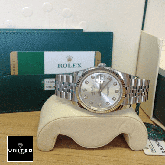 Rolex Datejust 116234-0084 Silver Dial 1 Rolex Datejust 36 116234-0084 on the clock cushion & Guarantee Card