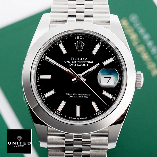 Rolex Datejust 11823 Black Dial Steel Jubilee  next to warranty card