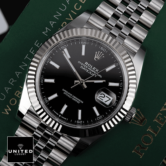 Rolex Datejust 126234 Black Dial Jubilee Bracelet  on the warranty card