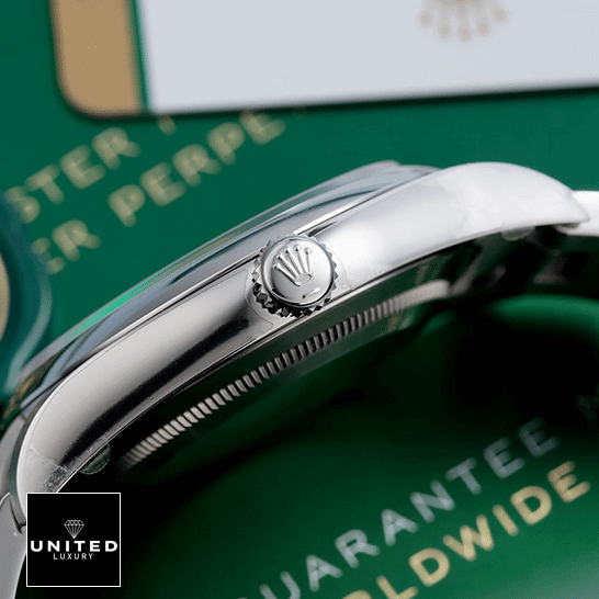 Rolex Datejust Perpetual 114300 Stainless Steel Case & Crown Pusher  Right Side on the table