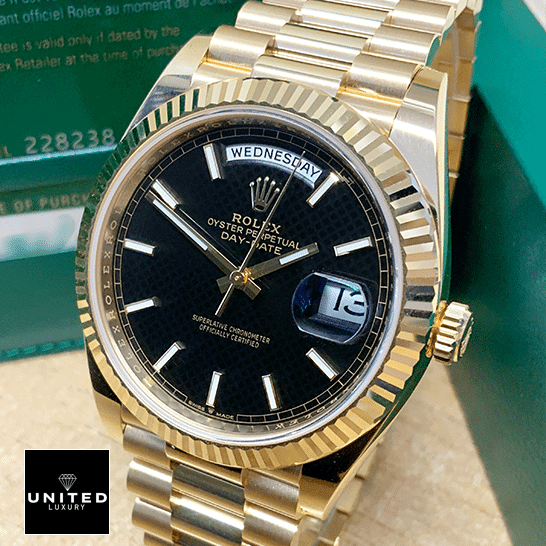 Rolex Day-Date Gold Black 228235 EW 2 Rolex Day-Date 228235 beside the Rolex Box