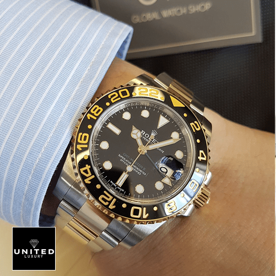 under the shirt Rolex GMT-Master II 116713 Two Tone Oyster  on his arm