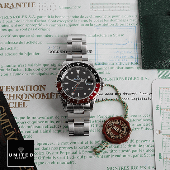 Rolex GMT-Master II Coke 16710 Black & Red Bezel  on the warranty certificate