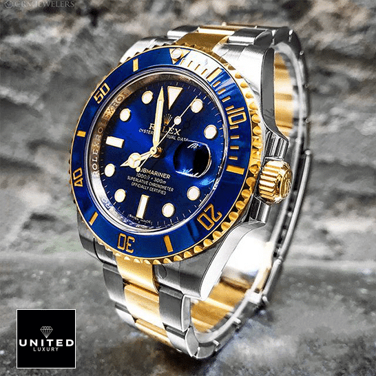 Rolex Submariner Date Two Tone Blue Dial 16613 6 Rolex Submariner Date Two Tone Blue Dial 16613 on the table