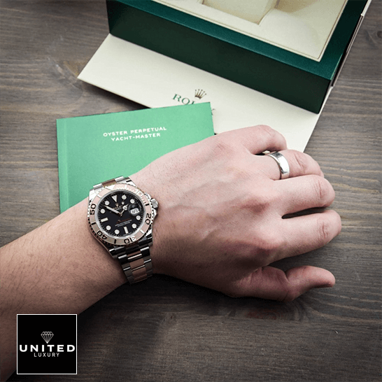 Rolex Yatch Master 116621 Rose Gold Black Dial  warranty card next to