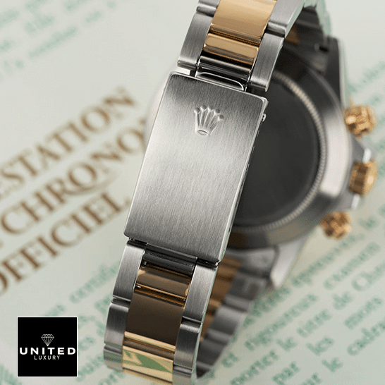 Rolex Daytona S.Steel Two Tone Bracelet Fold Clasp 16523  on the table